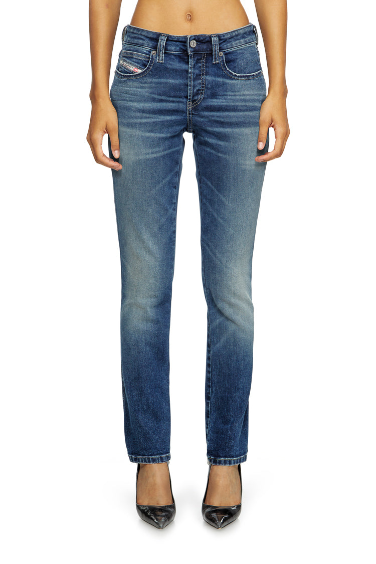 Blue jeans worn by a person on a white background