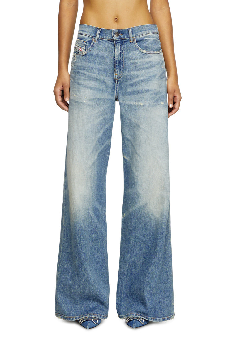 person wearing blue baggy jeans on a white background