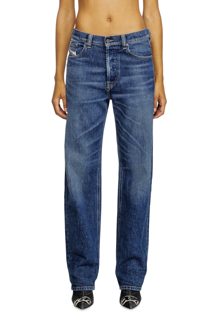 person wearing blue jeans on a white background